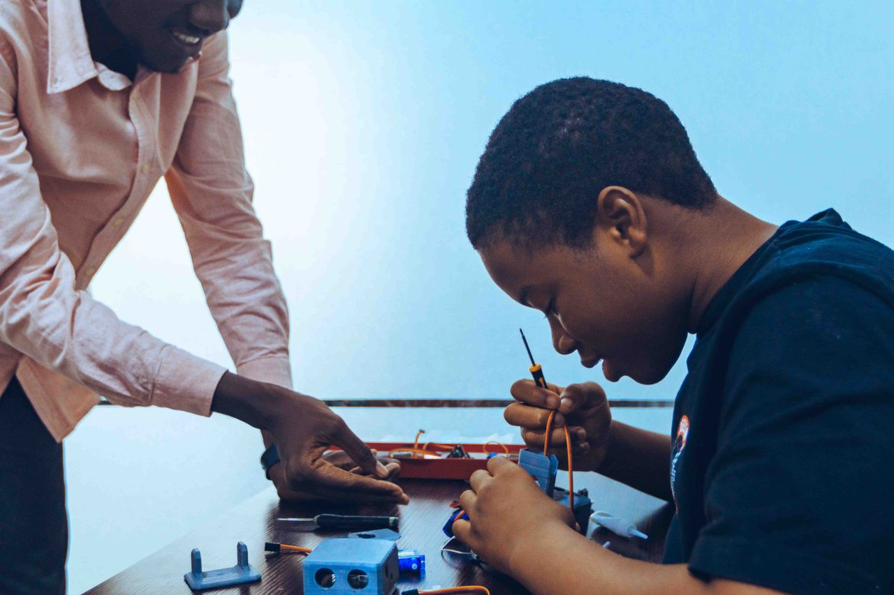 heros-img A student and a teacher engage in practical electronics learning in a classroom environment.